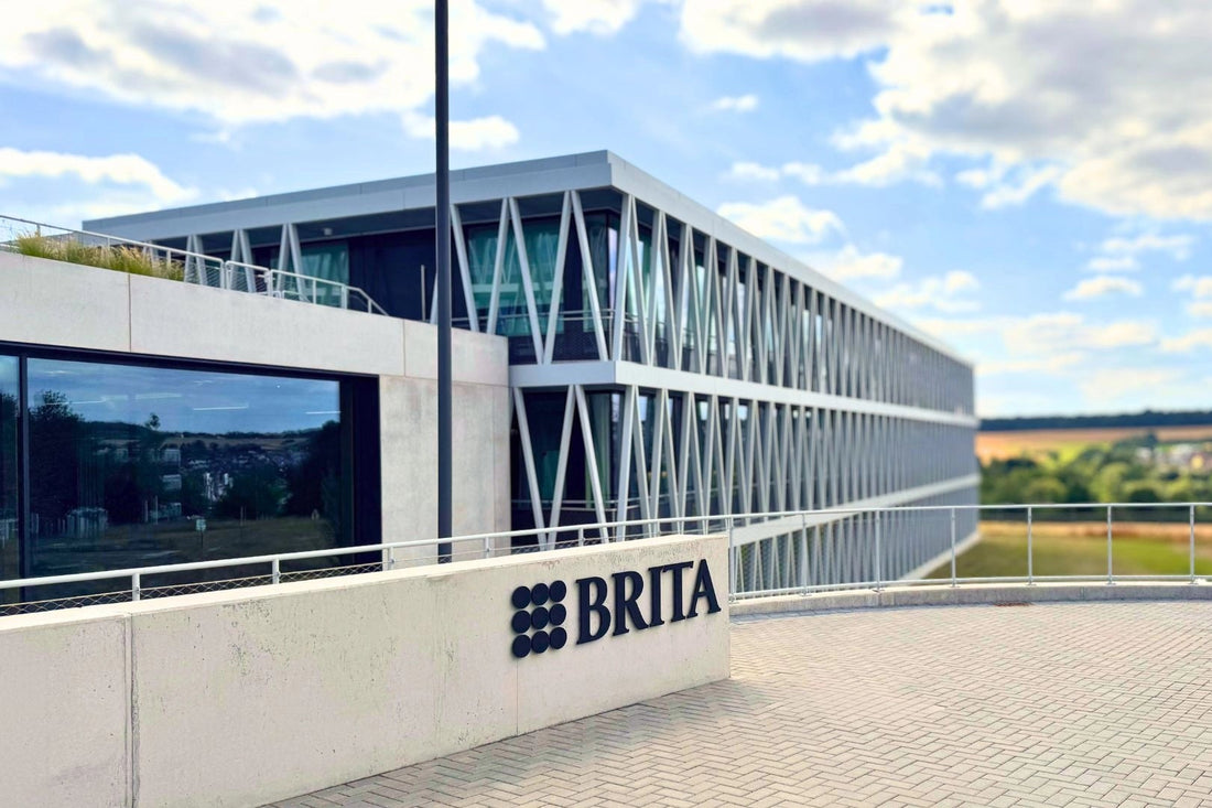 BRITA office building with clear blue sky and landscape.
