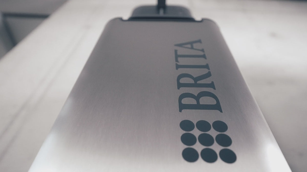 Load video: BRITA Top Compact water dispenser, showcasing the features as the small office hero.